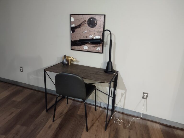 Tidy home office corner with a desk and chair