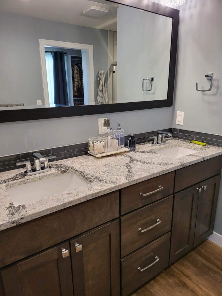 Bathroom vanity with marble worktop and double sinks after cleaning