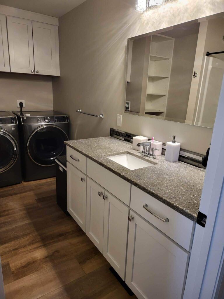 Laundry area and bathroom vanity wiped down and tidy