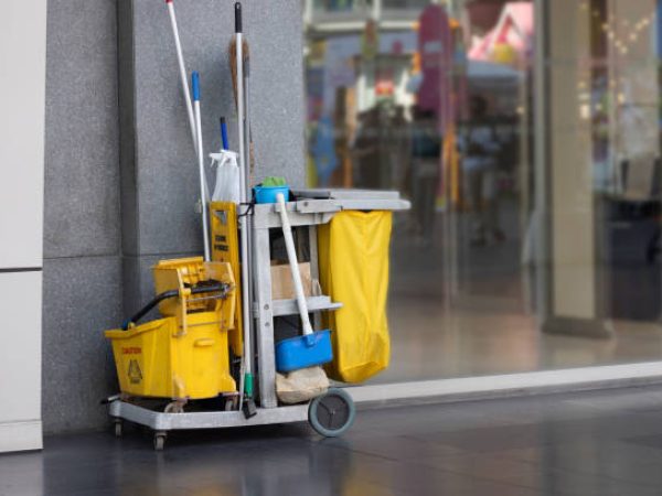 Nebraska Elite Cleaning technician wiping windows for streak-free spotless glass finish.
