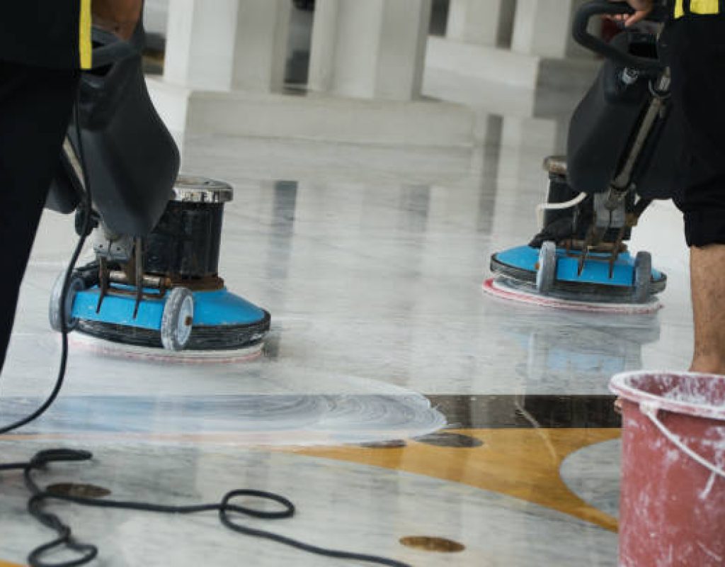 Commercial cleaning team disinfecting high traffic office areas thoroughly