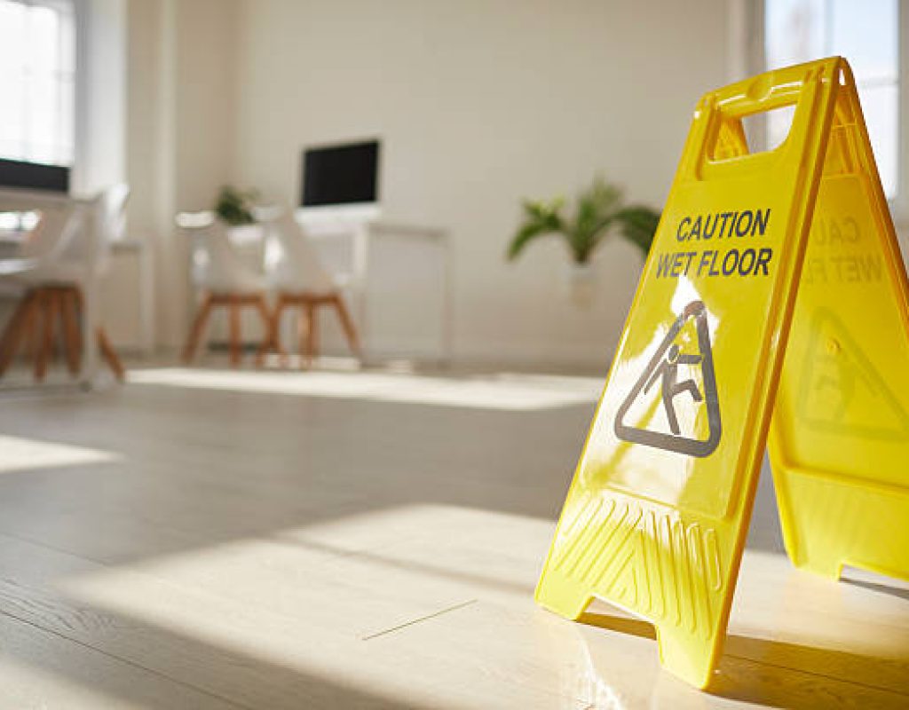 Reliable cleaning company staff sanitizing kitchen surfaces using high-quality cleaning products.