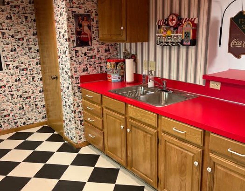 _uploads_nebraskaelitecleaning_2023_4_13_168140875653494EC1D4C24CAE859F9251B0642EFC House cleaner sanitizing kitchen surface in Ralston, NE